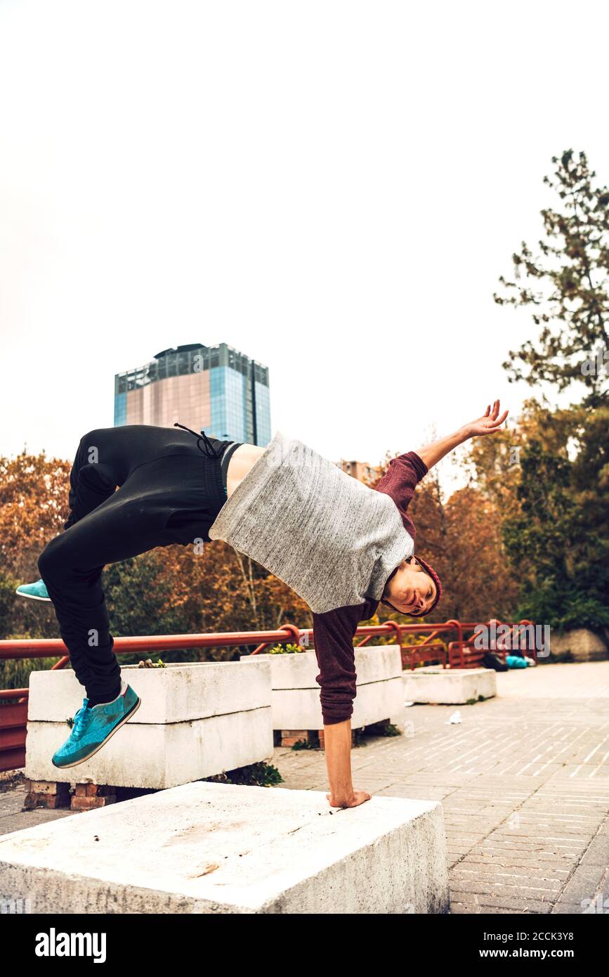 Young man jumping against clear sky Stock Photo