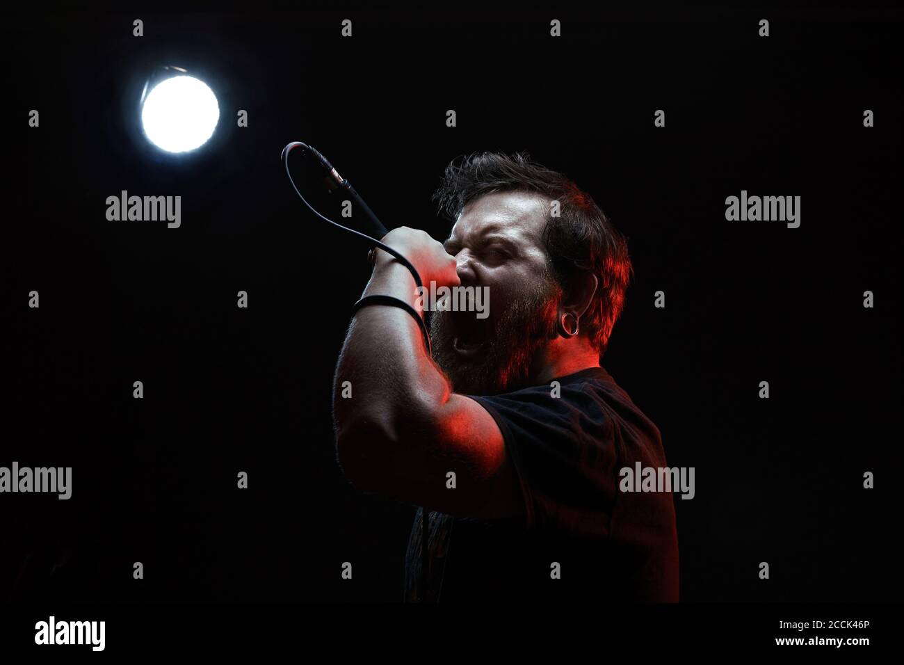 Portrait of singing rocker Stock Photo - Alamy
