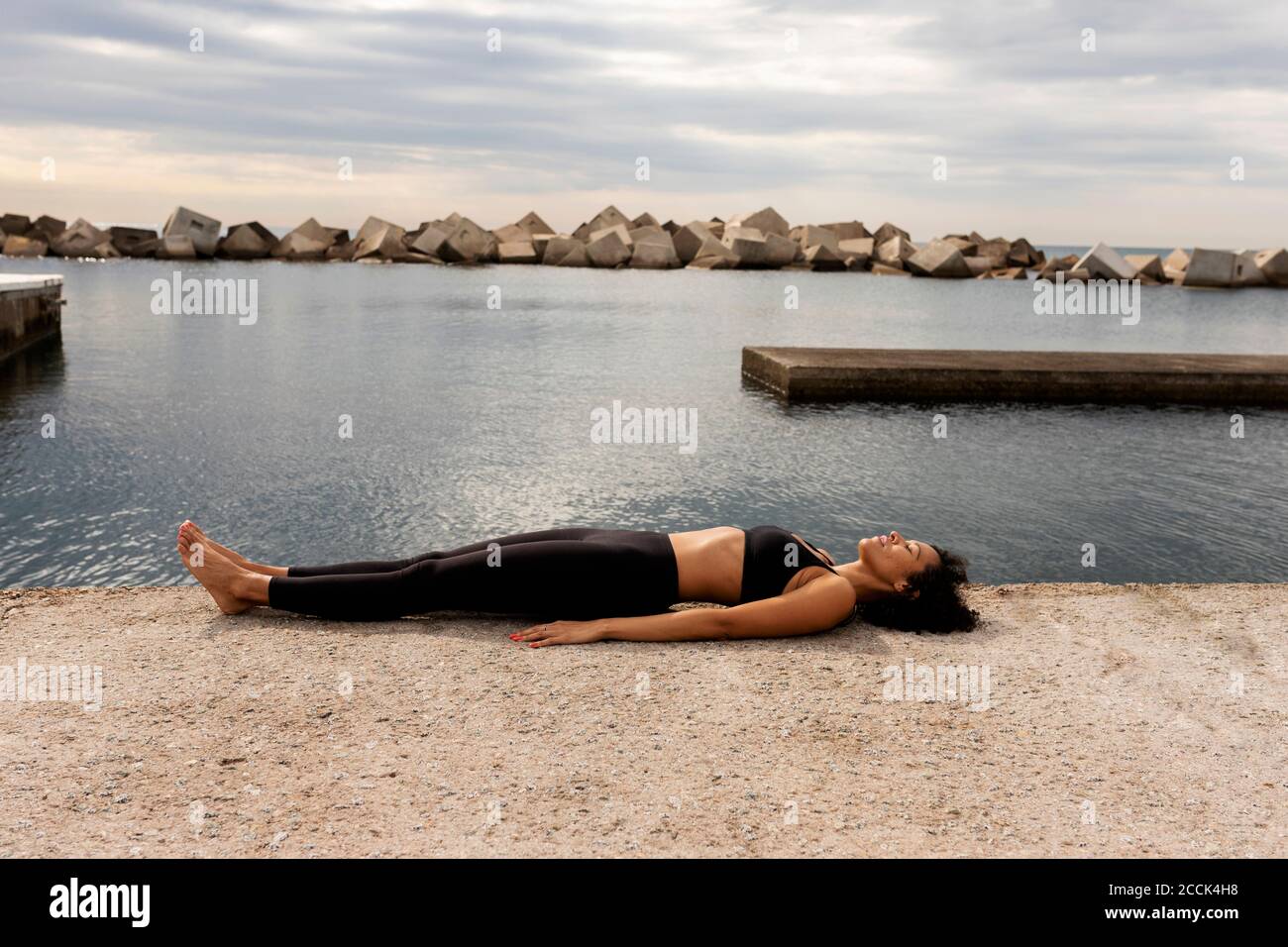 Woman lying in water side hi-res stock photography and images - Alamy