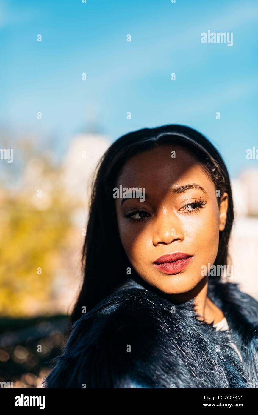 Beautiful African American woman looking away outdoors Stock Photo