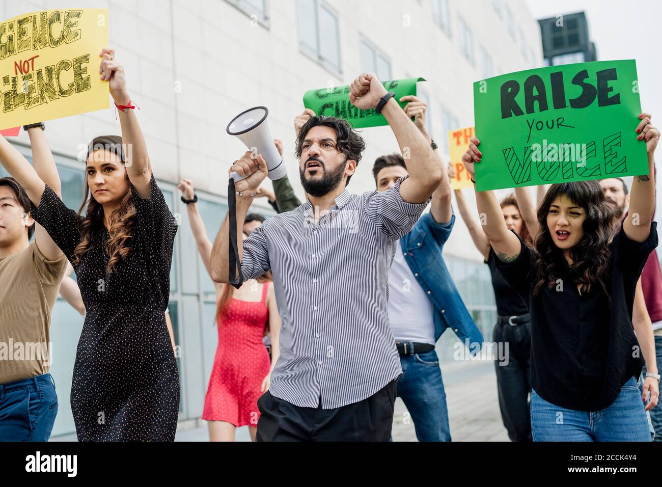 Multi ethnic activists protesting in city Stock Photo