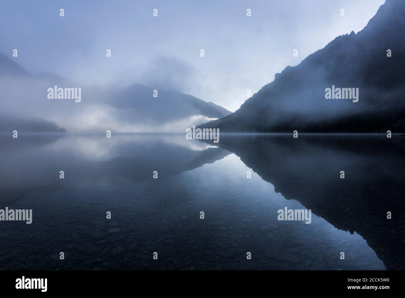 Fog at Lake Plansee, Tyrol, Austria Stock Photo