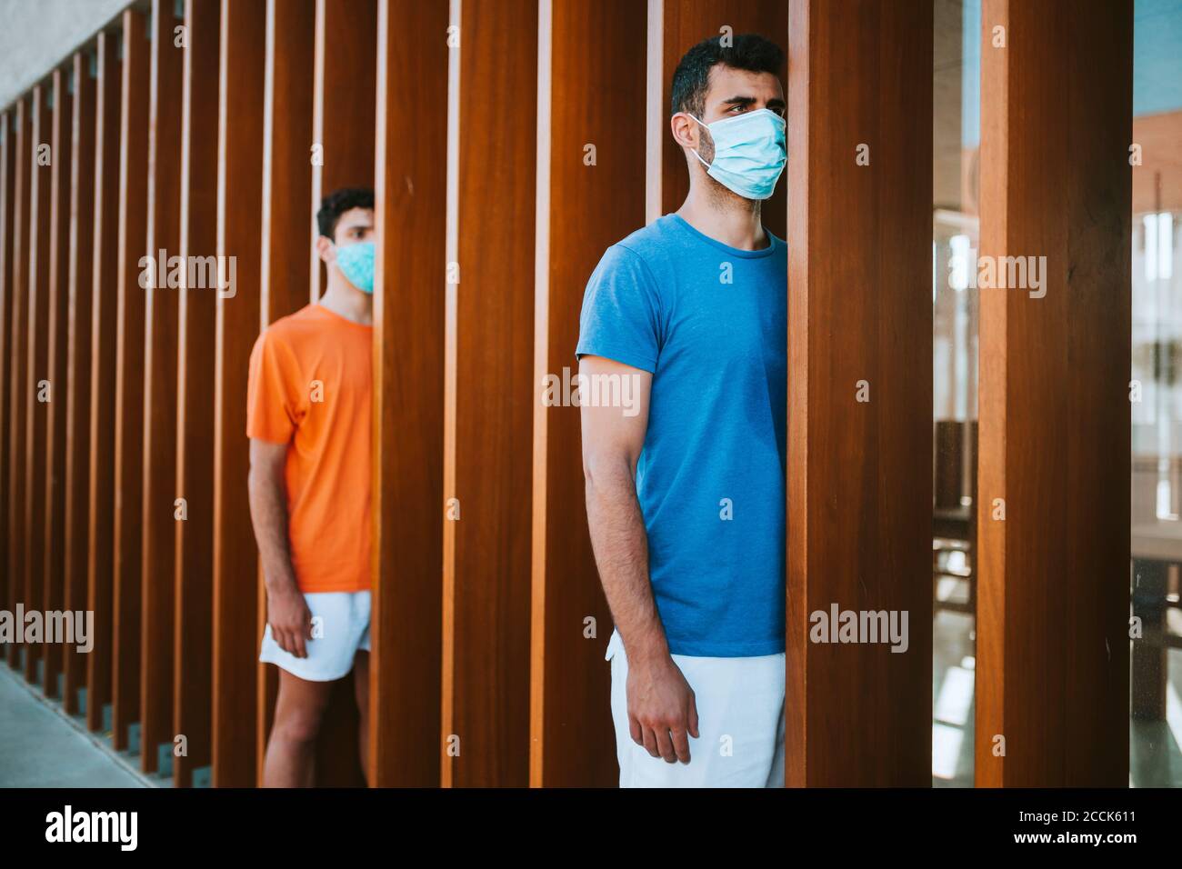 Three young adults wearing masks hi-res stock photography and images ...