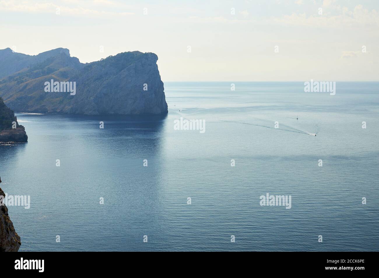 Recreational boats sailing next to Cap de Catalunya cape near Formentor cape (Formentor peninsula, Majorca, Balearic Islands, Mediterranean sea,Spain) Stock Photo