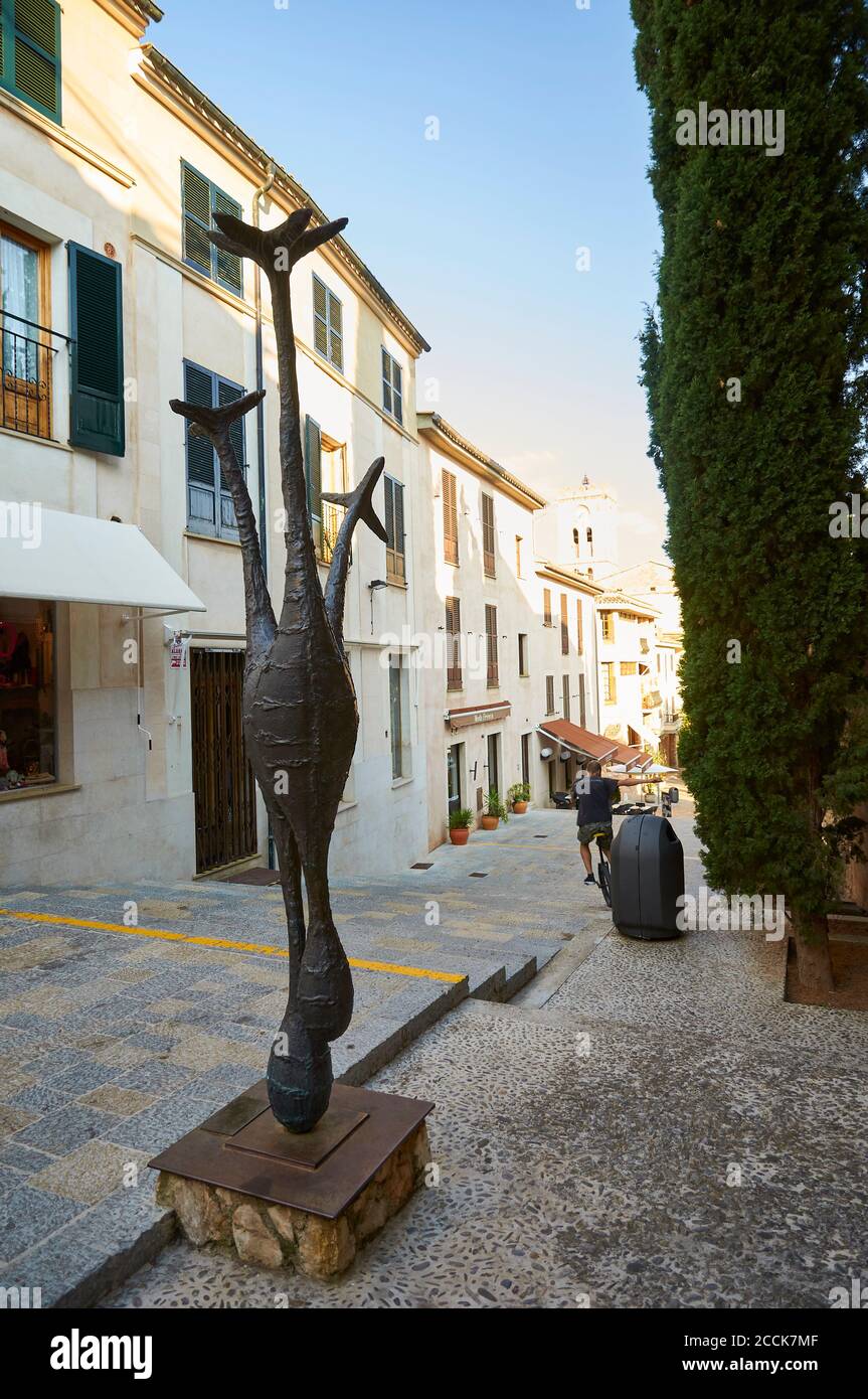 Sculpture by Robert J. Brotherton at a pedestrian street of Pollença old town (Pollensa, Majorca, Balearic Islands, Spain) Stock Photo