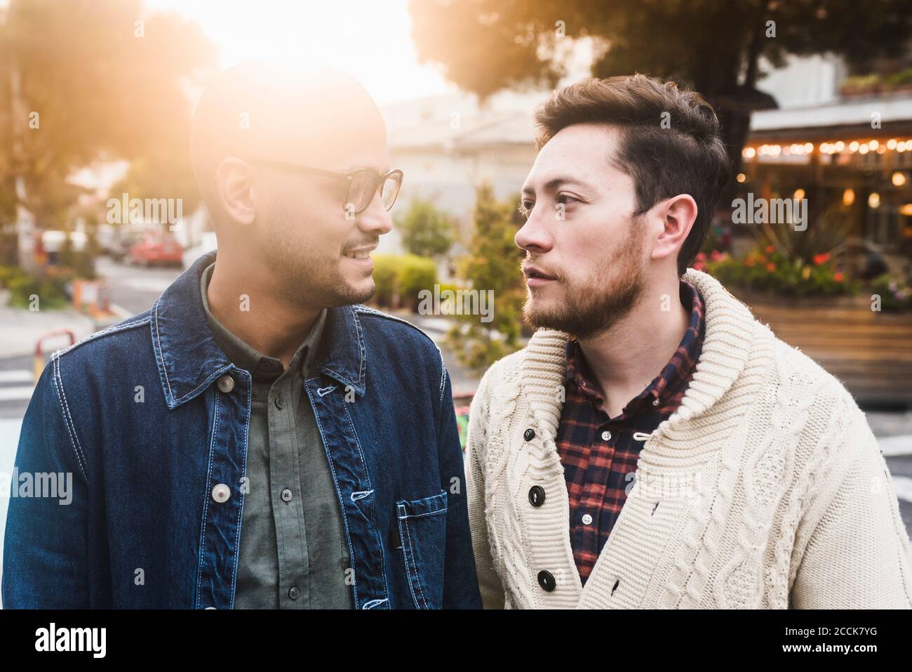 Close-up of gay couple looking at each other while standing in city Stock Photo