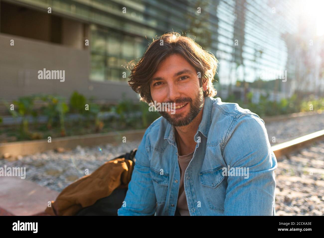 Happy man in denim jacket hi-res stock photography and images - Alamy