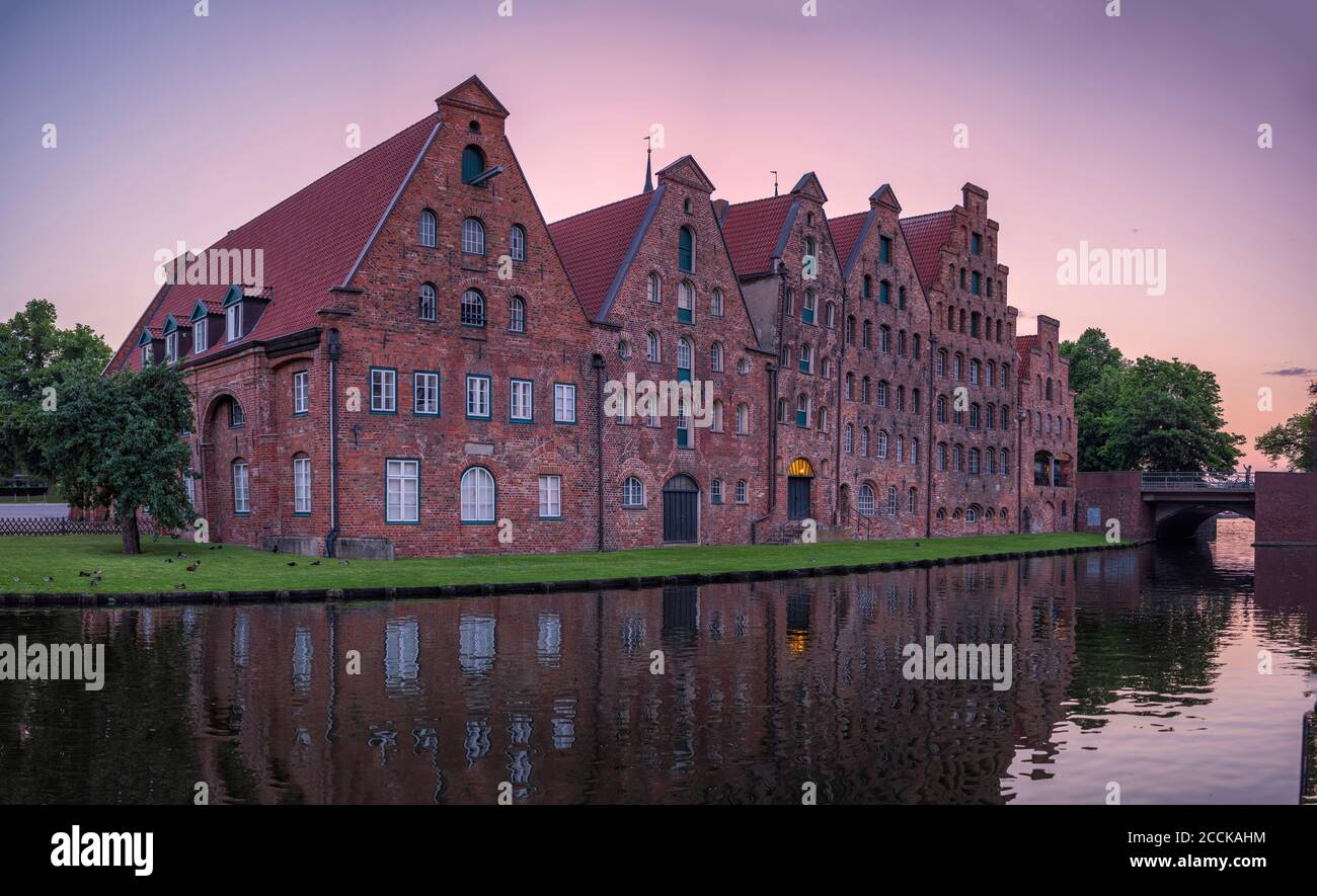 Germany, Schleswig-Holstein, Lubeck, Salzspeicher warehouses at dusk Stock Photo