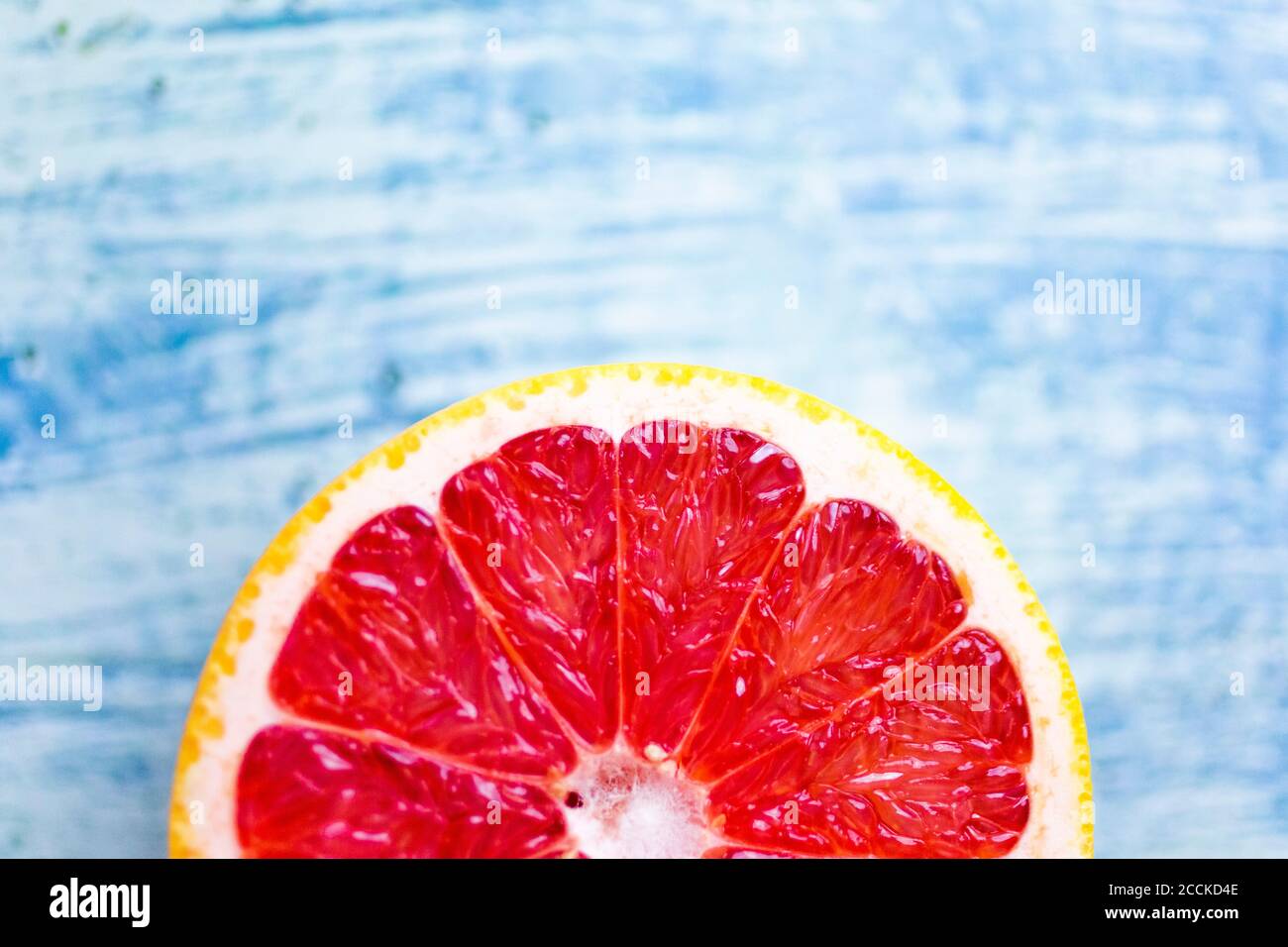 Fresh chopped grapefruit on wood Stock Photo