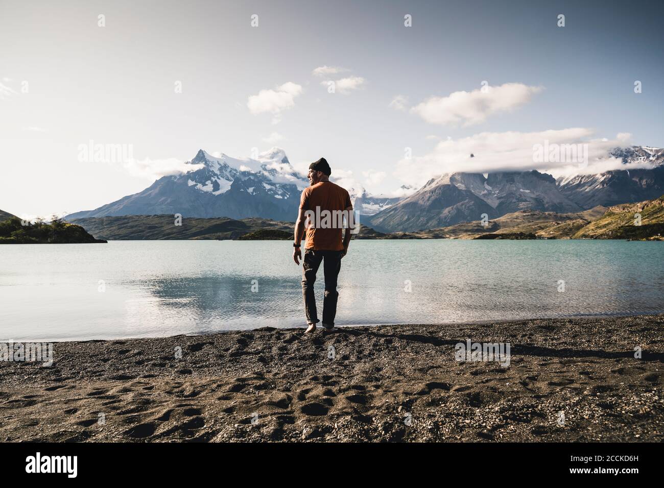 Man walking by lake Pehoe in Torres Del Paine National Park Patagonia, South America Stock Photo