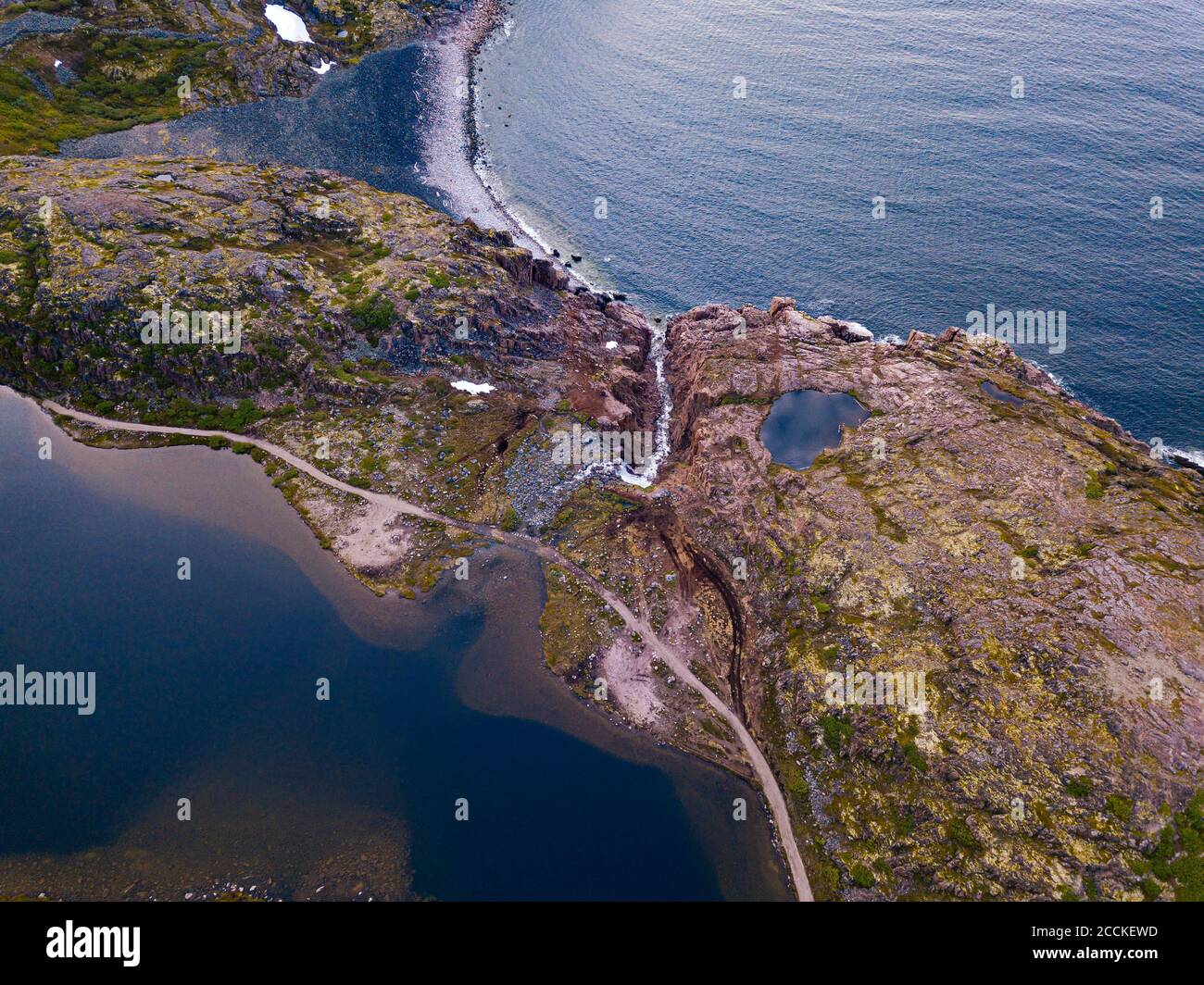 Russia, Murmansk Oblast, Teriberka, Aerial view of waterfall at coast