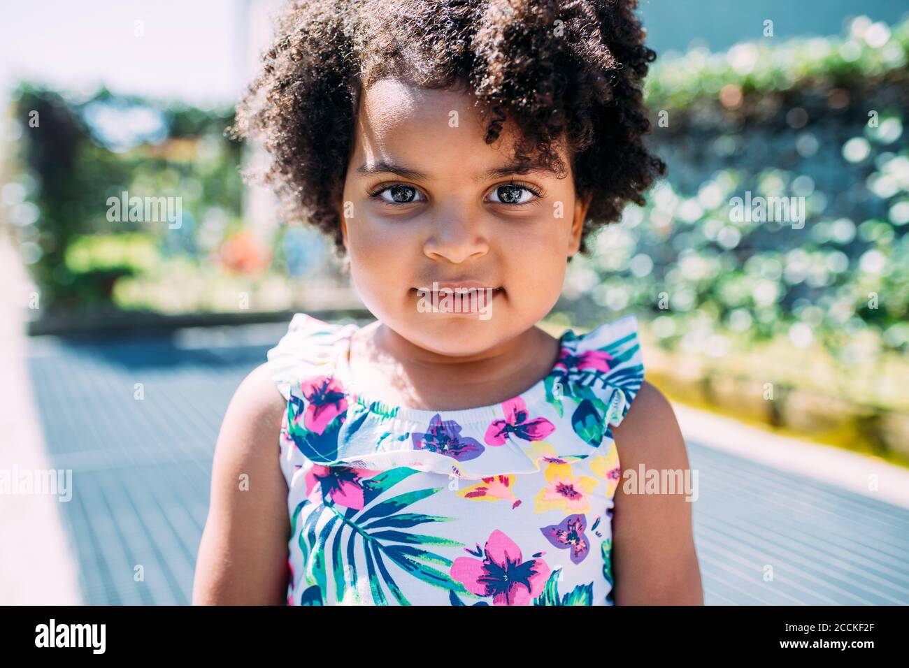 Baby with black curly hair hi-res stock photography and images - Alamy