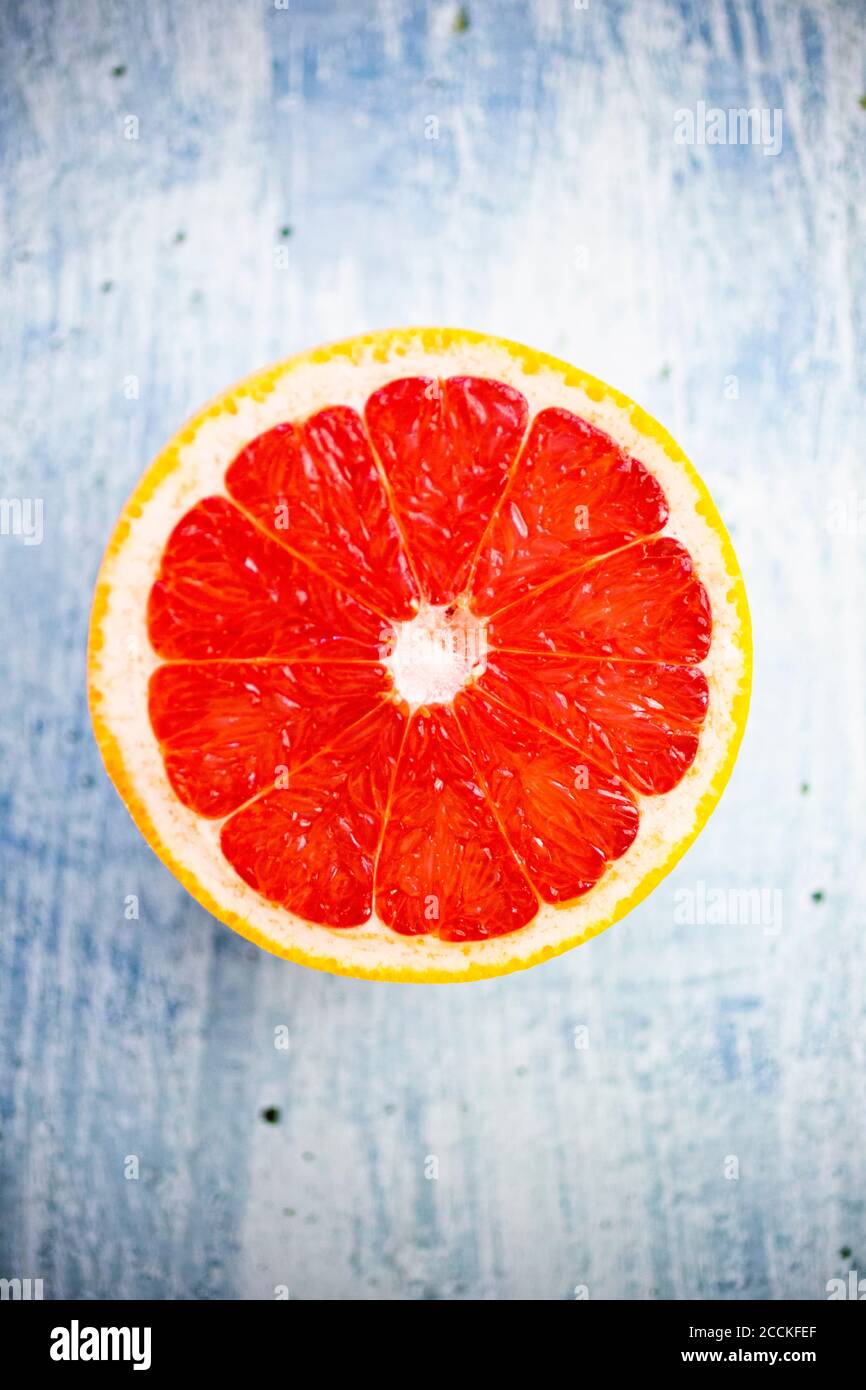 Fresh chopped grapefruit on wood Stock Photo