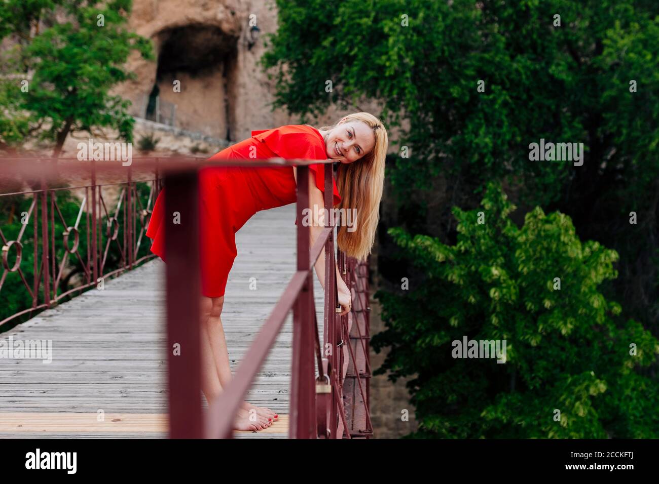 Female looking over bridge hi-res stock photography and images - Alamy