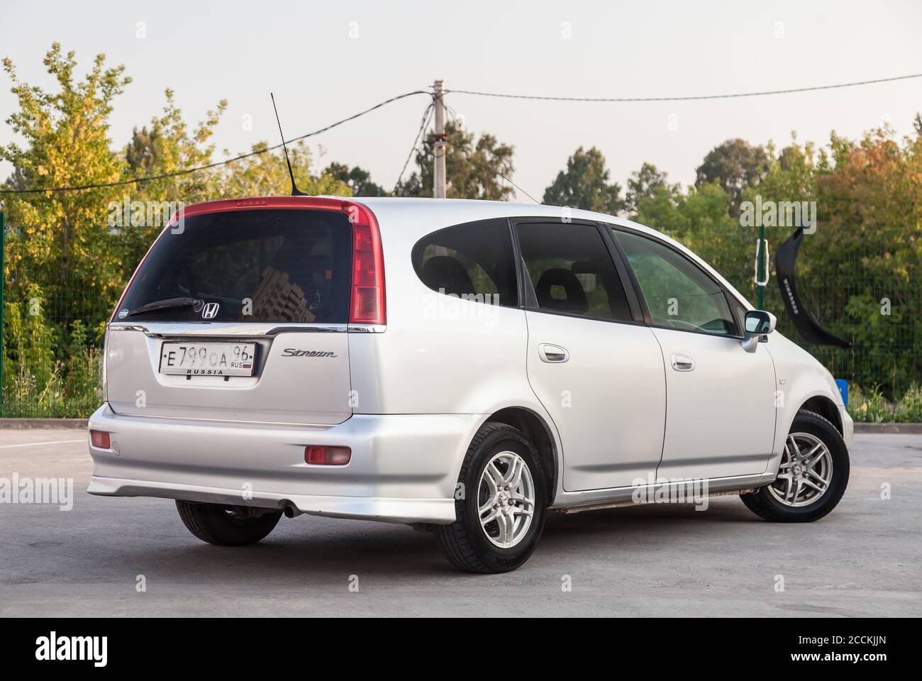 Novosibirsk, Russia - 08.05.20: Rear quater view of a Honda Stream car in a  silver body Japanese 2002 year van in a parking lot with a green trees and  Stock Photo - Alamy