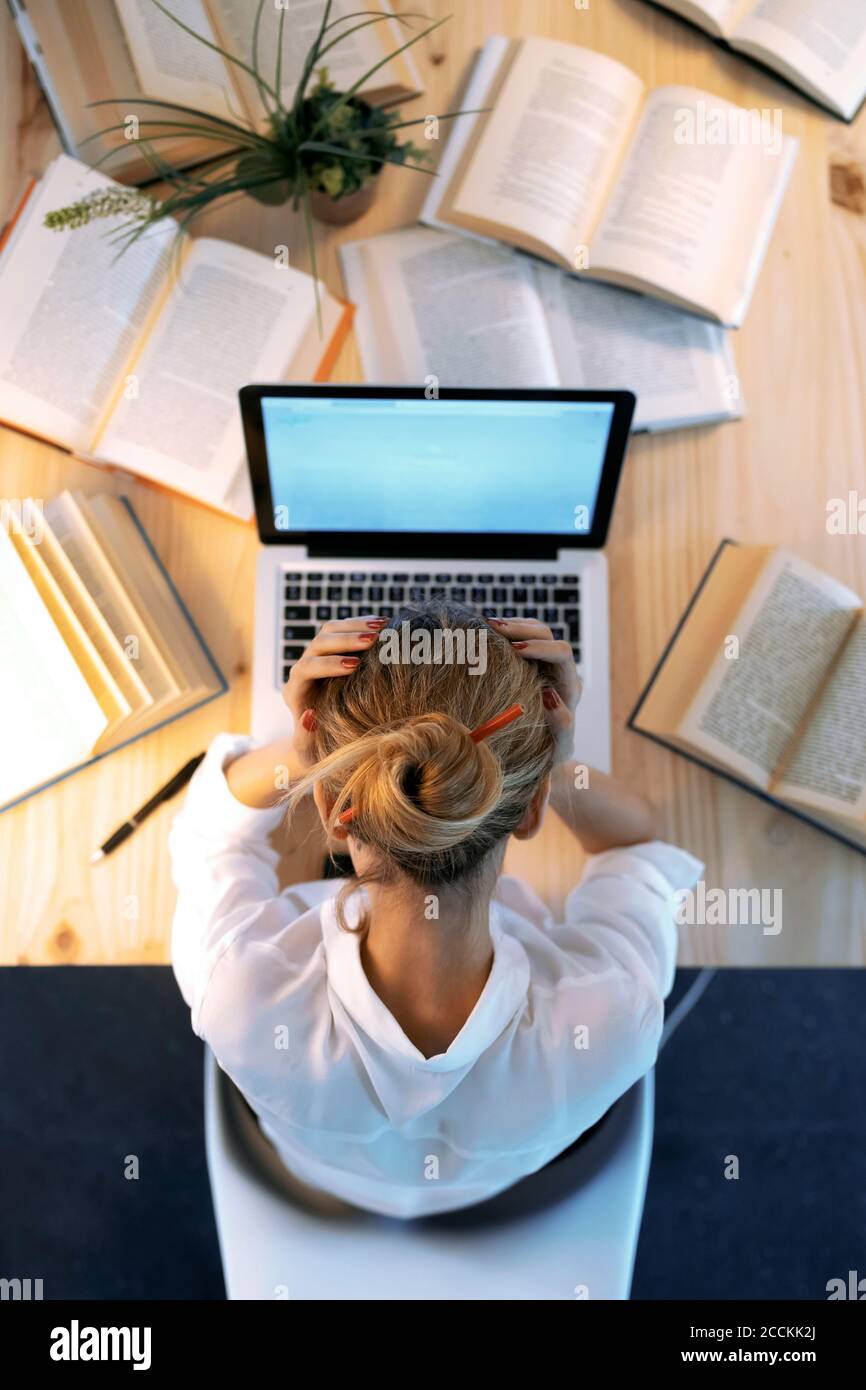 Woman head in hands book hi-res stock photography and images - Alamy