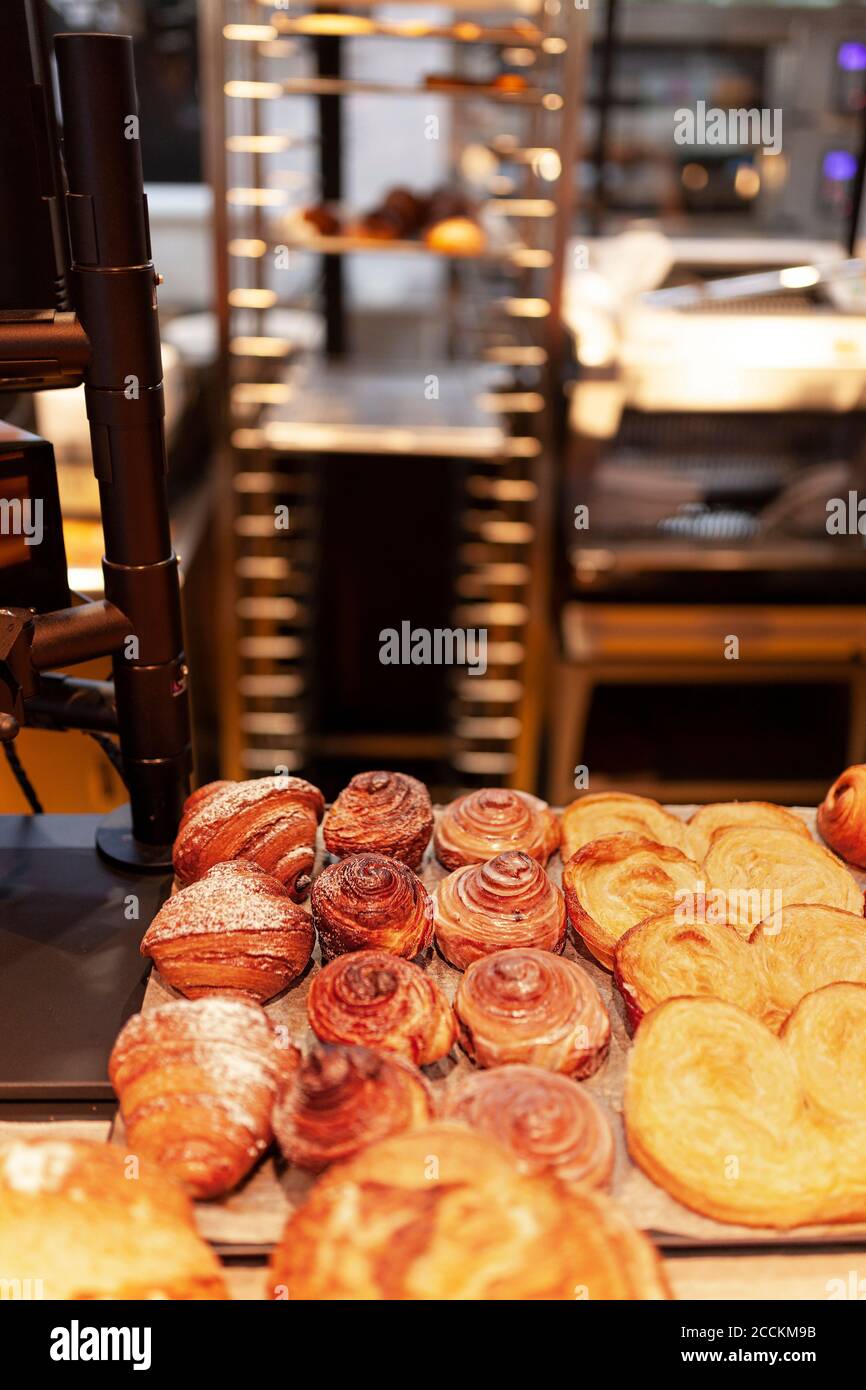 Close-up of prepared croissants and cinnamon rolls at bakery Stock Photo