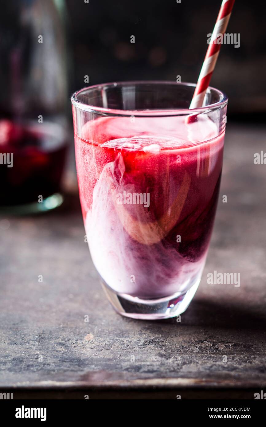 Wild berry infused black iced tea latte Stock Photo