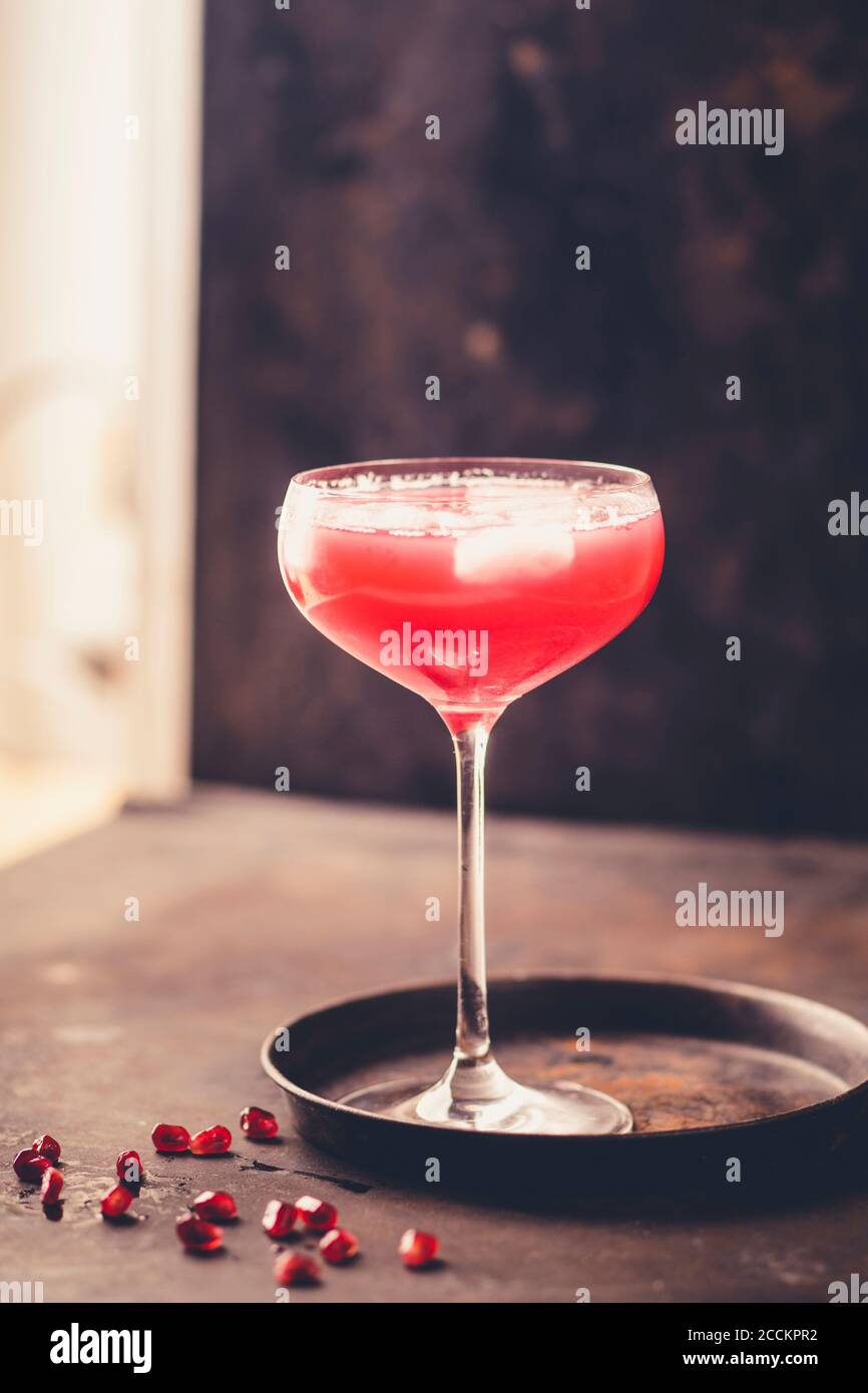 Glass of pomegranate fizz with pomegranate juice, ice cubes and tonic water Stock Photo Alamy