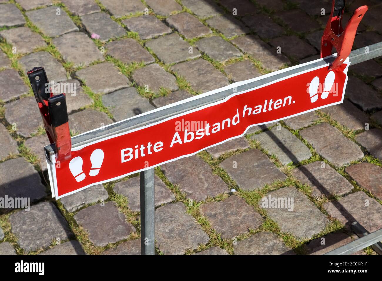 Bitte Abstand Halten! 1.5 meter social distancing sign for COVID-19. Keep distance symbol in german language Stock Photo