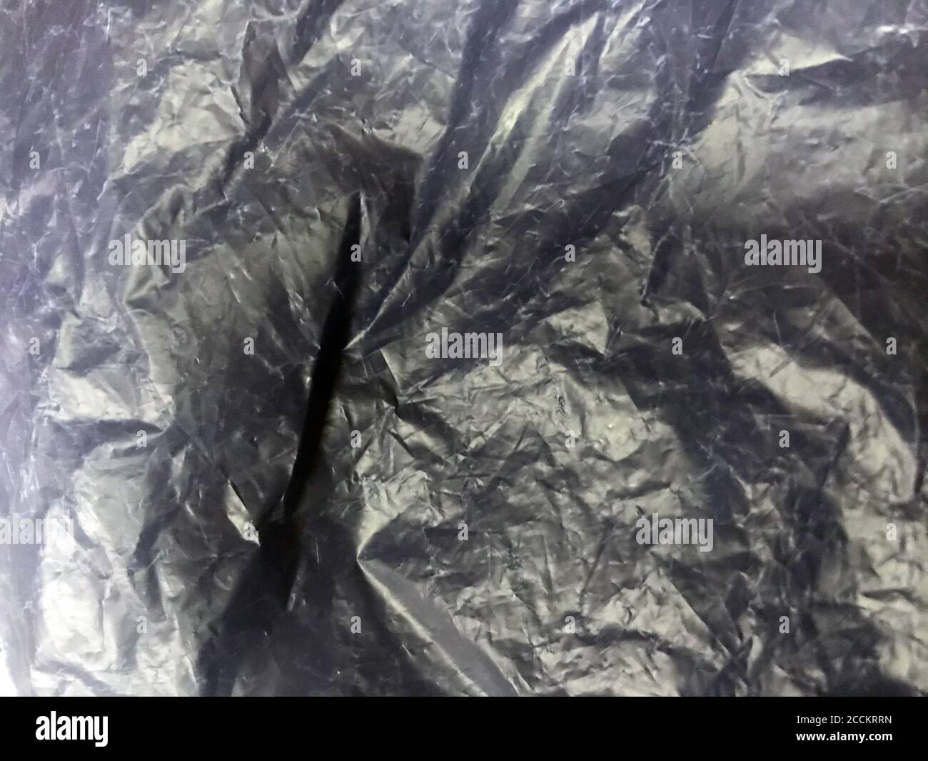 Cellophane plastic background texture packaging pattern shiny. Bag material industrial close up wrap Stock Photo