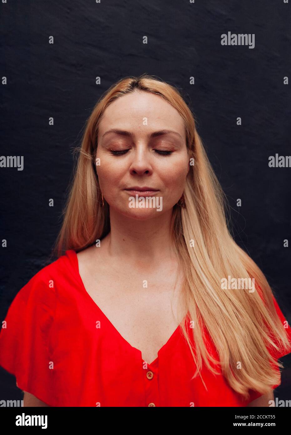 Portrait of blond woman with closed eyes Stock Photo - Alamy