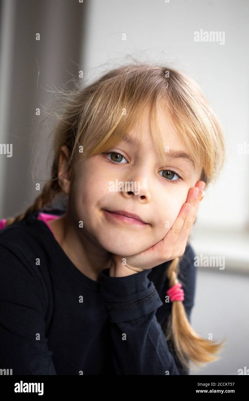 Hand on chin girl serious hi-res stock photography and images - Alamy