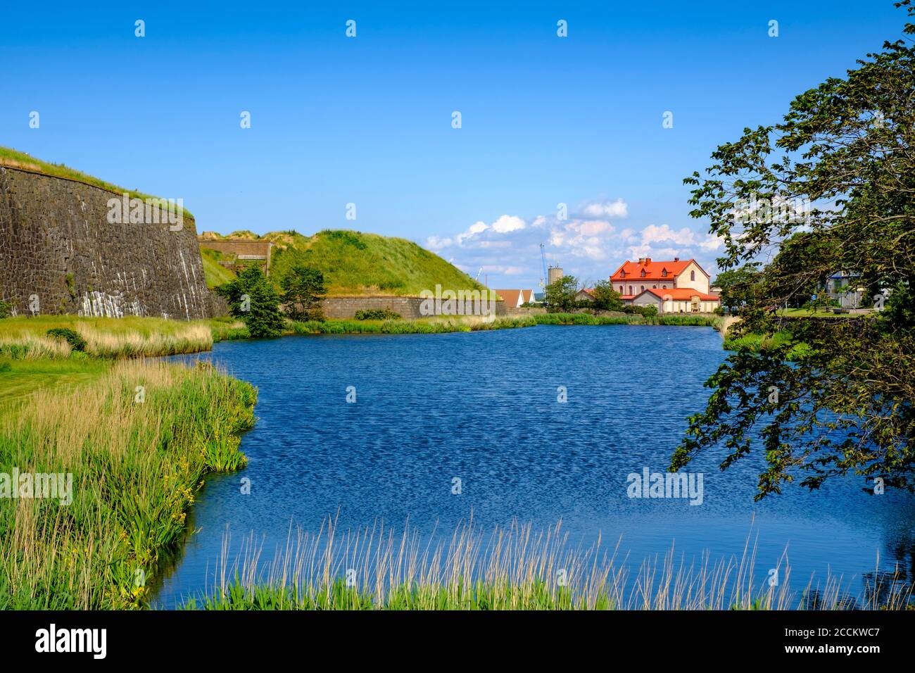 Sweden, Halland County, Varberg, Blue riverbank in summer Stock Photo