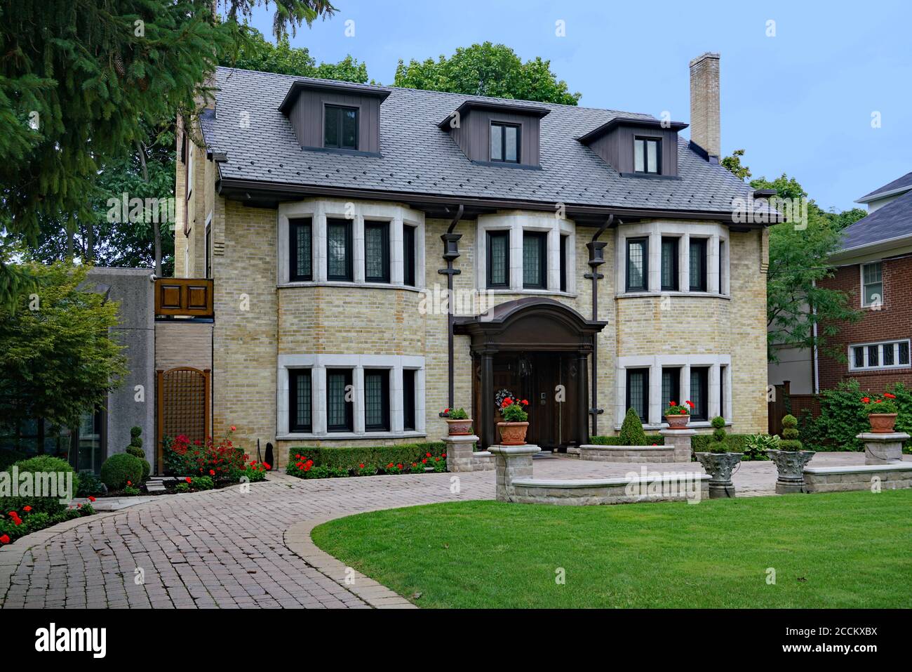 large older detached house with attractive landscaping, typical of Forest Hill or Rosedale district of Toronto Stock Photo