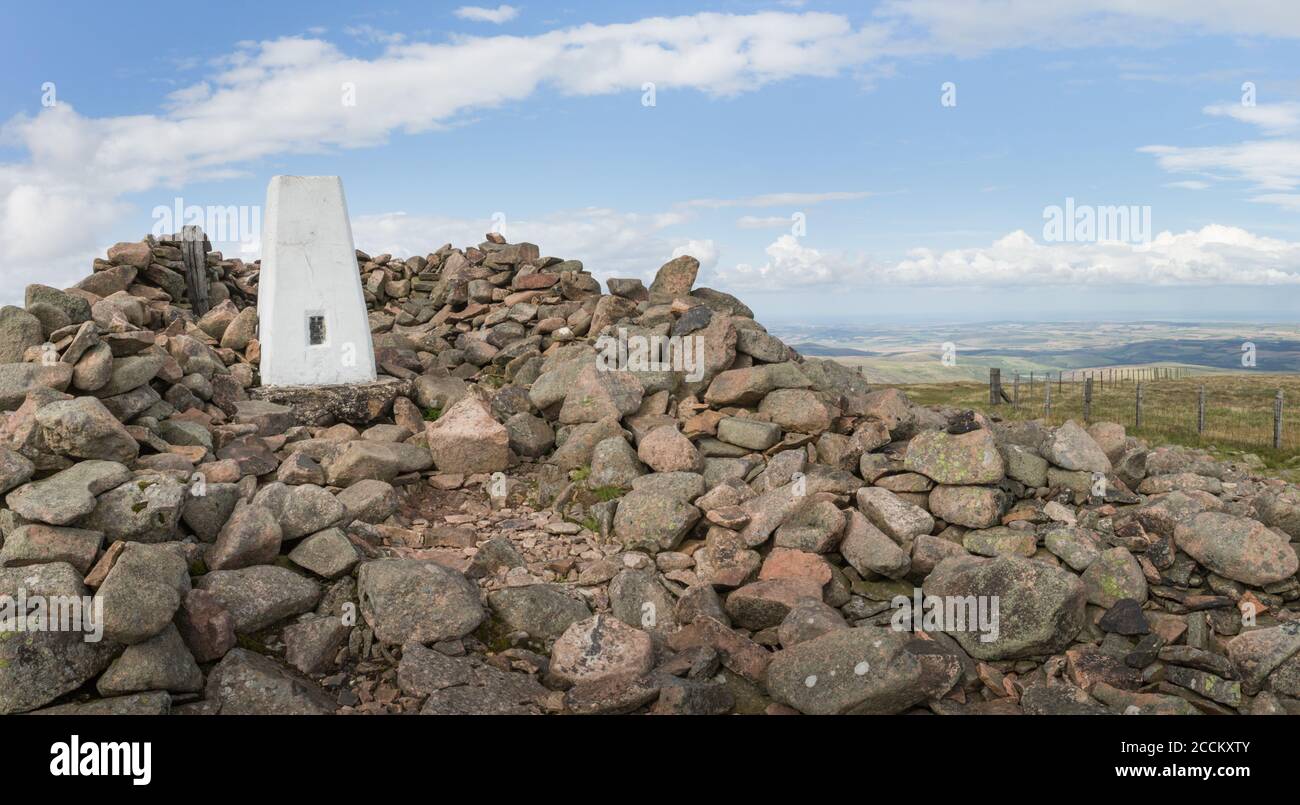 Hedgehope Hill summit trig point and wind shelter at the end of the walk from Breamish Valley, Northumberland National Park in August late summer. Stock Photo