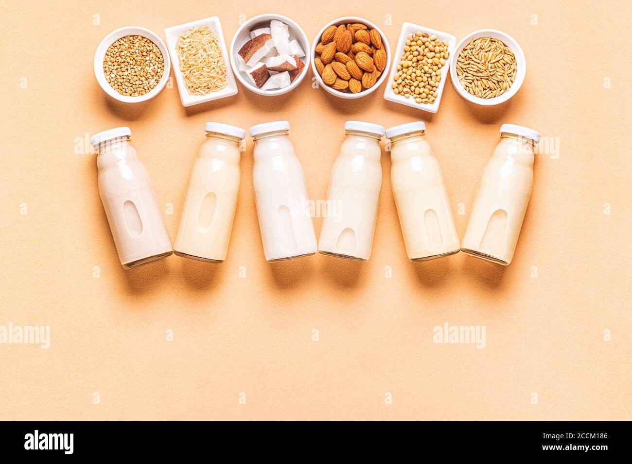 A bottles of alternative  milk and ingredients, top view. Stock Photo
