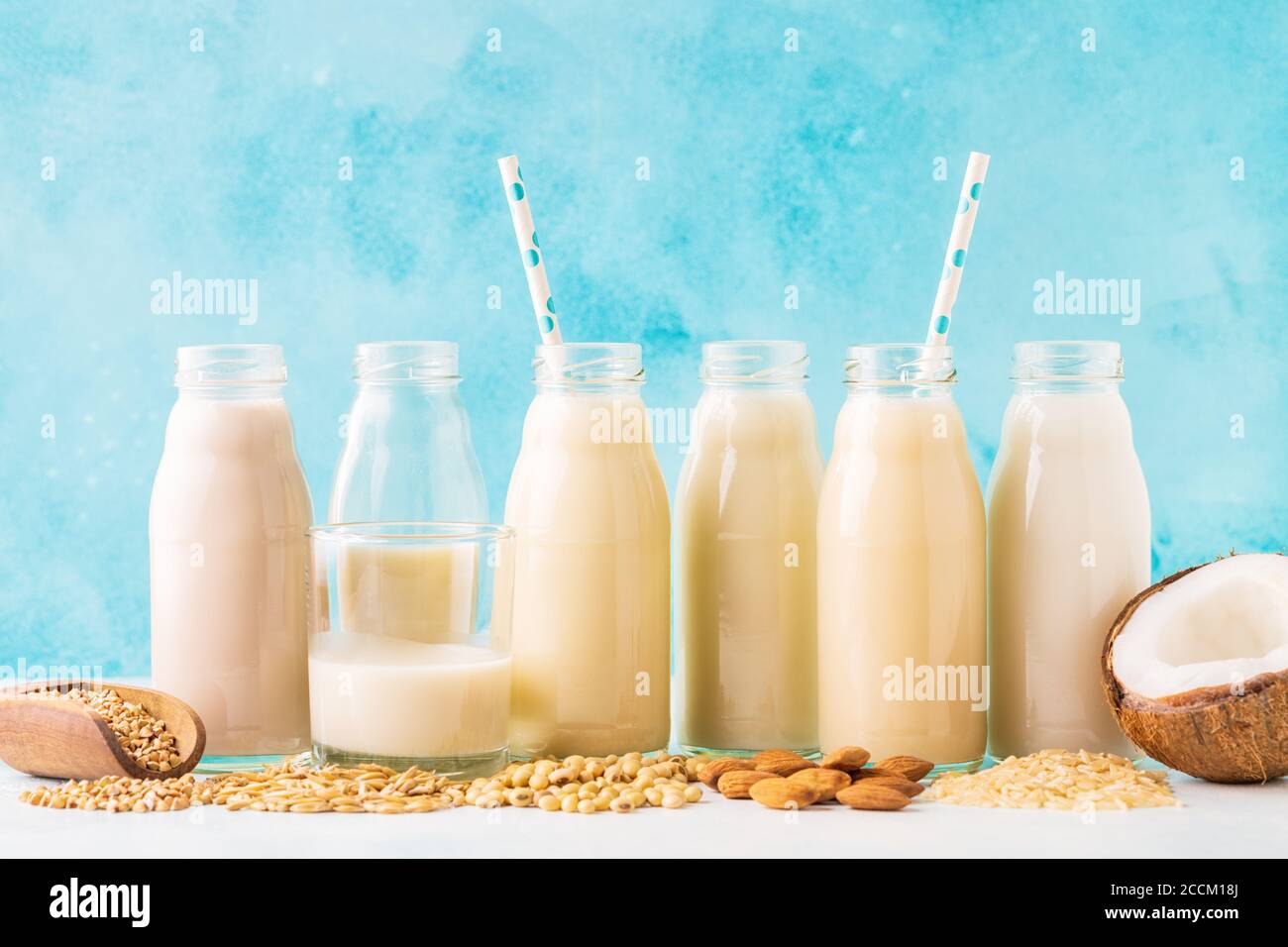 A bottles of alternative  milk and ingredients for cooking. Stock Photo