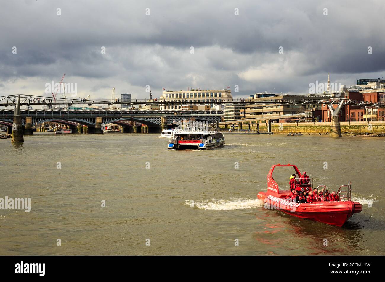 Thames River, London, 2020.  Pleasure boats on the River Thames oare a popular way of seeing the sights of London.  Tourists enjoying themselves on pl Stock Photo