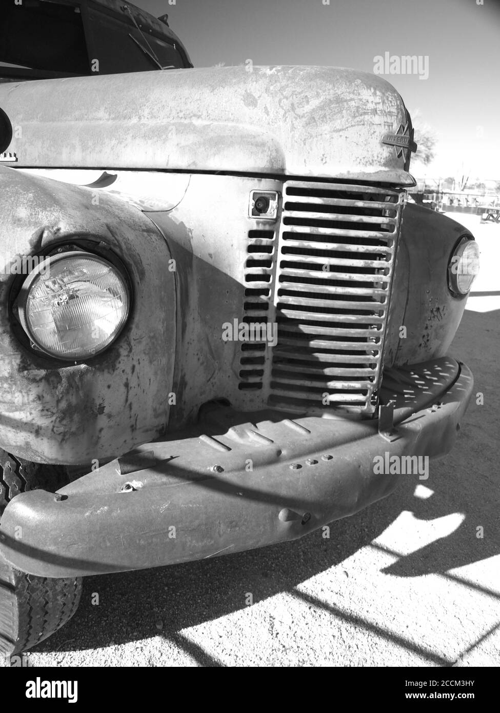 Black and white  image of an old International flatbed truck near Scottsdale, Arizona, USA.  Derelict truck is forlorn sitting in the desert. Stock Photo