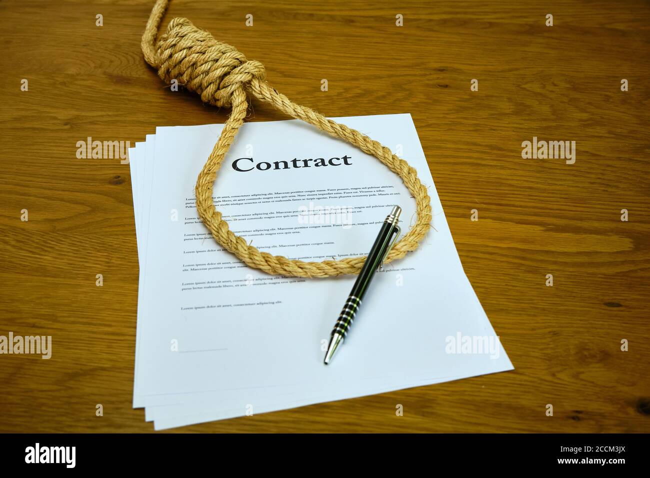 Contract with pen and rope tied in hangmans noose. Strangulation contract, unfair agreement. Lorum Ipsum text Stock Photo