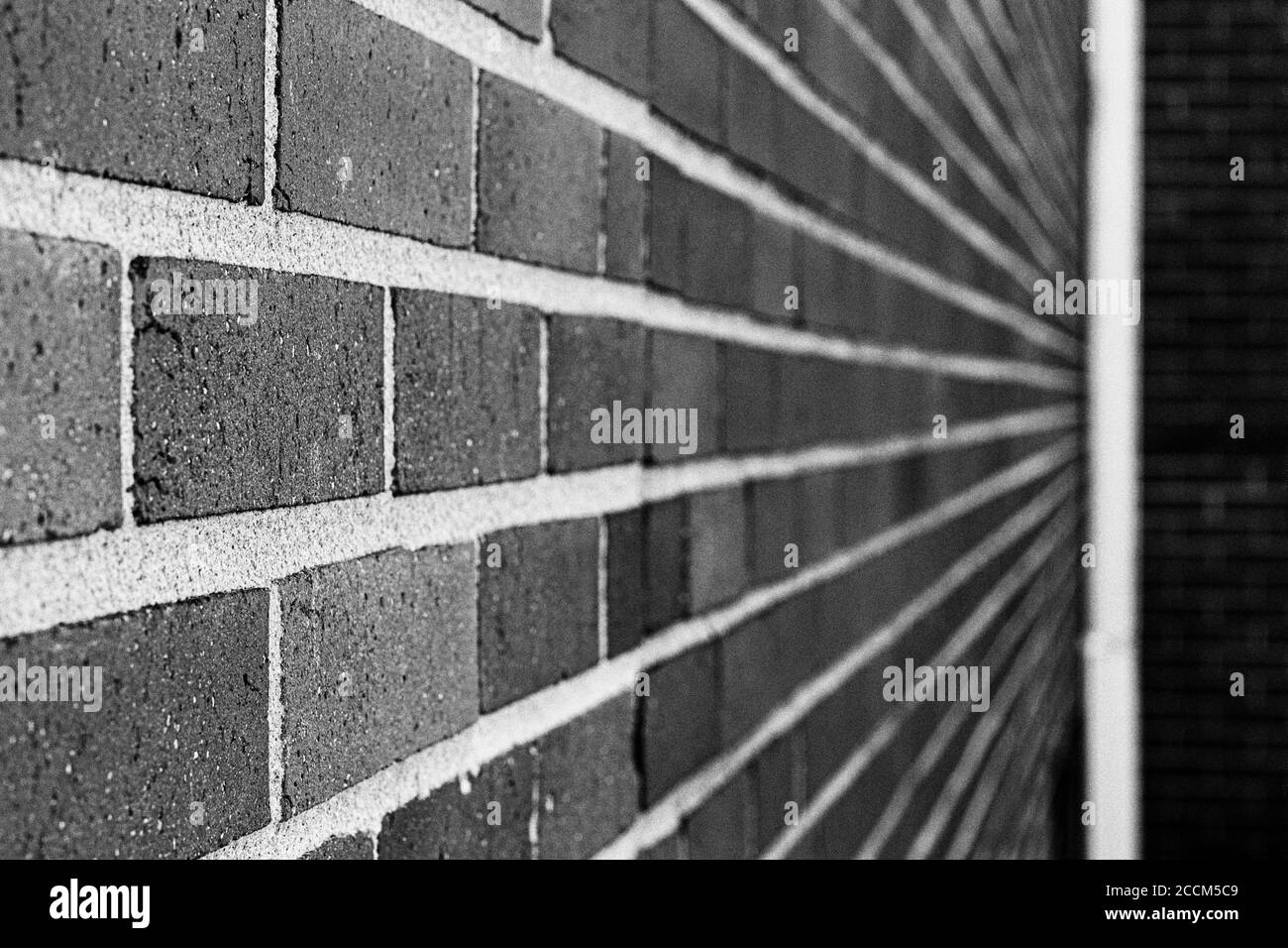 Converging lines meet at their focal point, a drain pipe Stock Photo