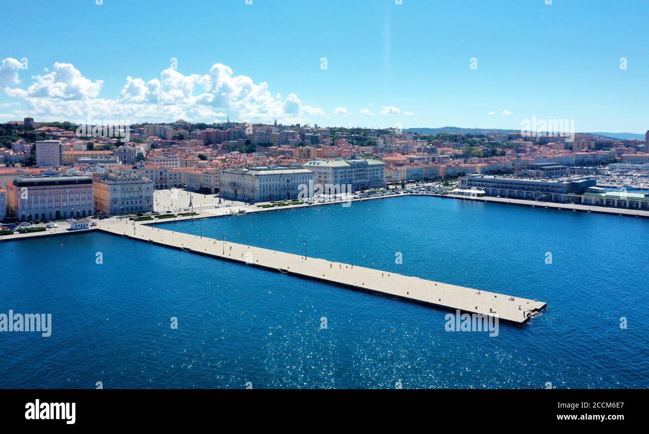 Trieste: Molo Audace e Piazza Unità d'Italia in a panoramic view from above during sunny day with blue sea and sky Stock Photo