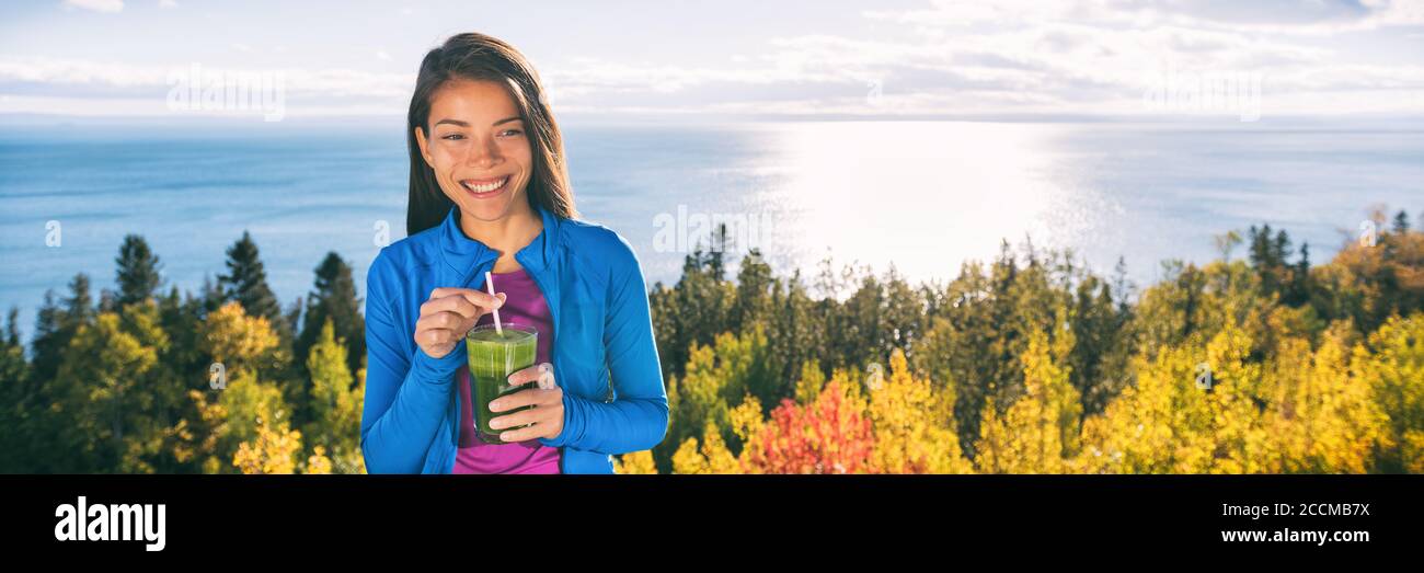 Healthy autumn woman drinking green smoothie glass Stock Photo