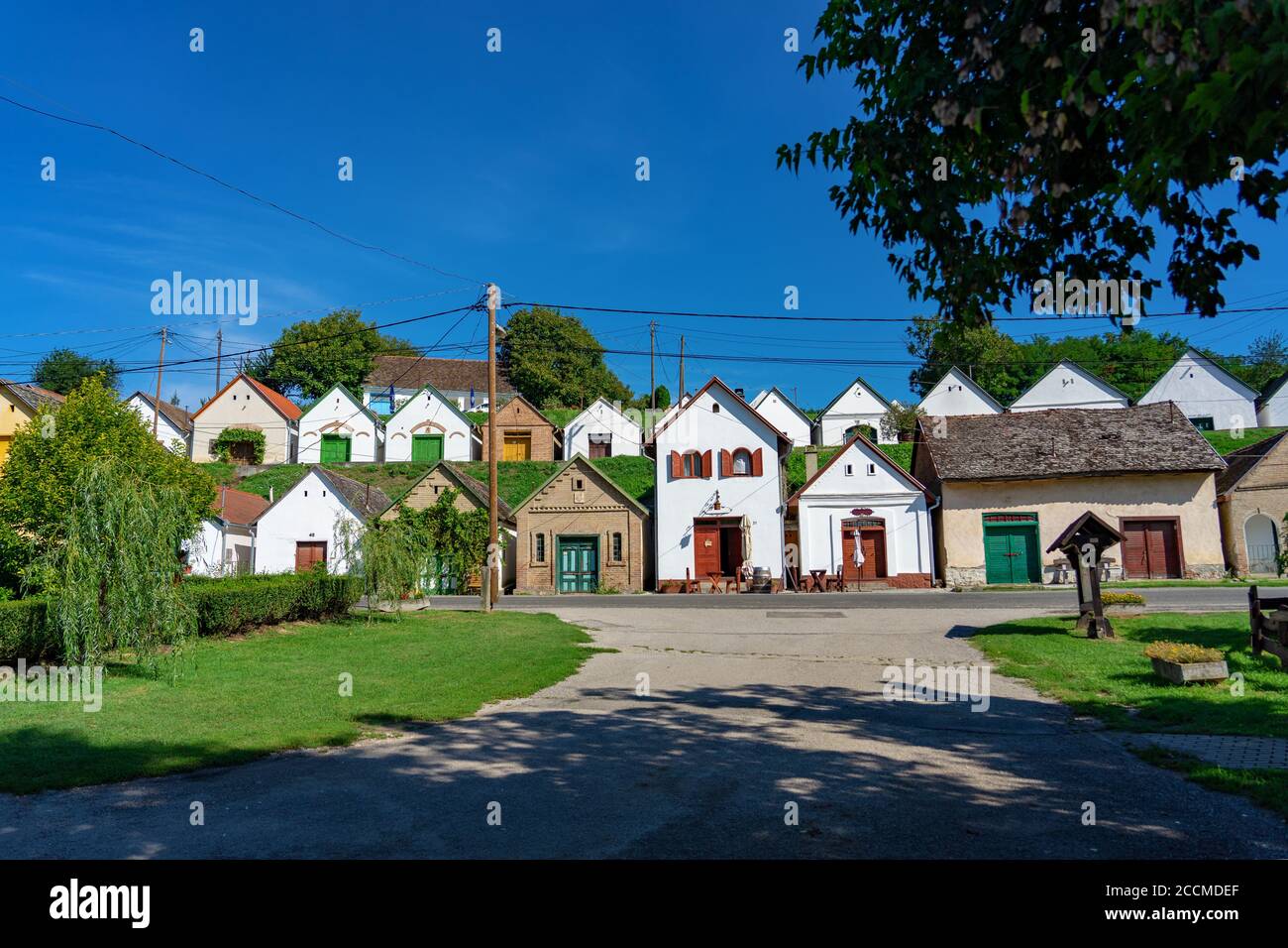 many colorful old traditional wine cellers in Villanykovesd in a hungarian wine region called Villany Stock Photo