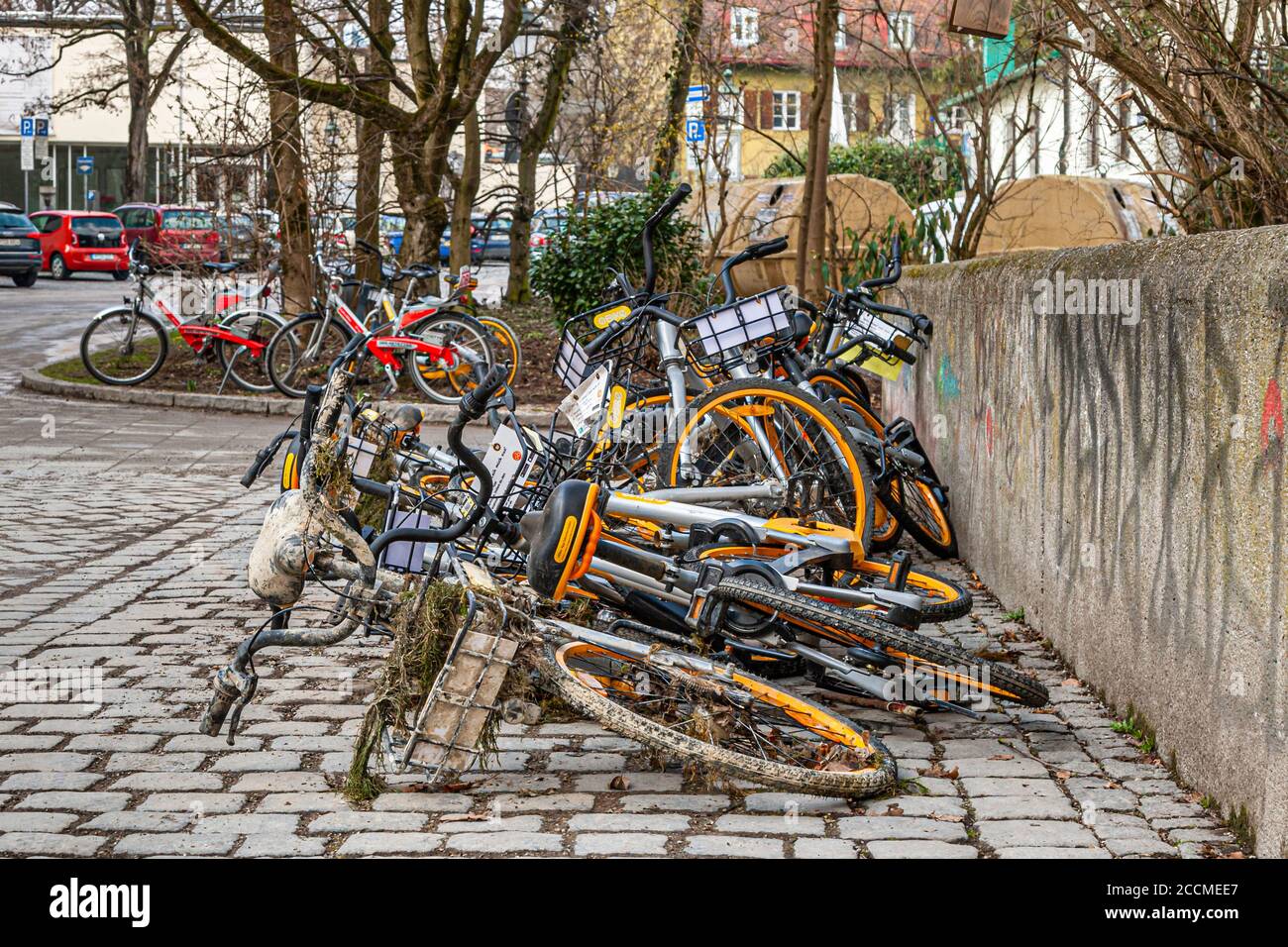 Bicycles for rent are disposed in the river Isar in Munich, Germany Stock Photo
