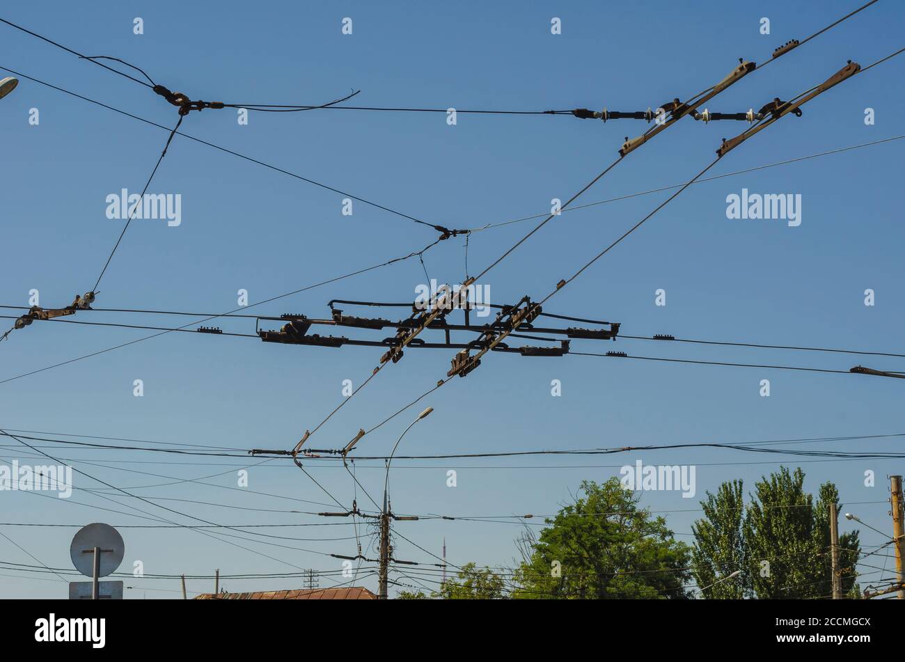 The sky over the intersection with many trolleybus wires. Electric city