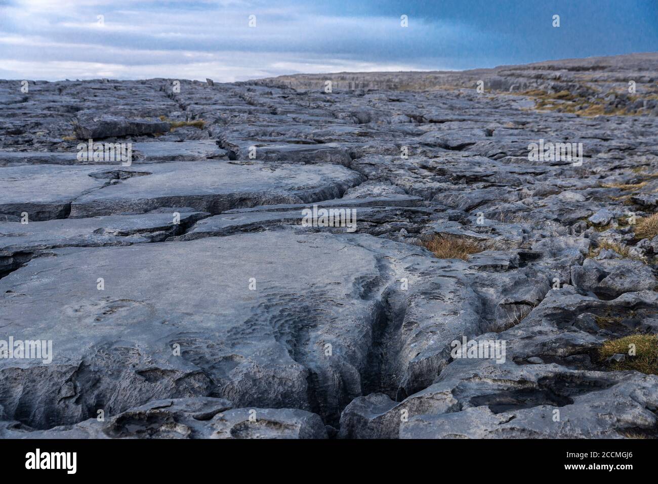 Karst landscape of the Burren at sunset in County Clare, province of Munster, bordered on the west by the Atlantic Ocean, on the coast of Ireland Stock Photo