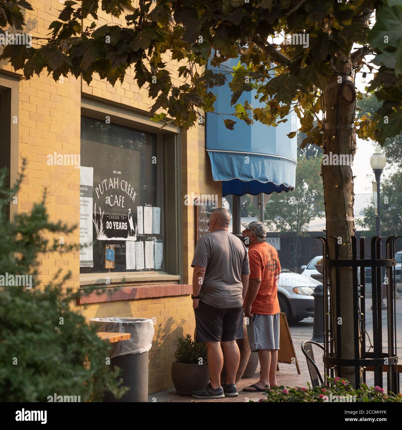 Winters, California, USA, 23 August 2020. Customers wearing face