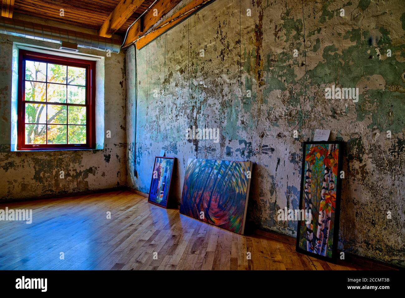View of an empty art studio with painting on the floor Stock Photo