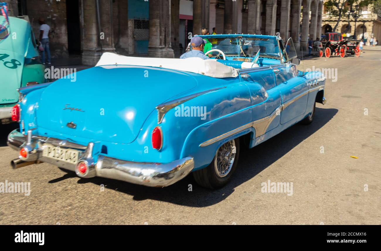 rear view of blue vintage American car in Havana cuba Stock Photo