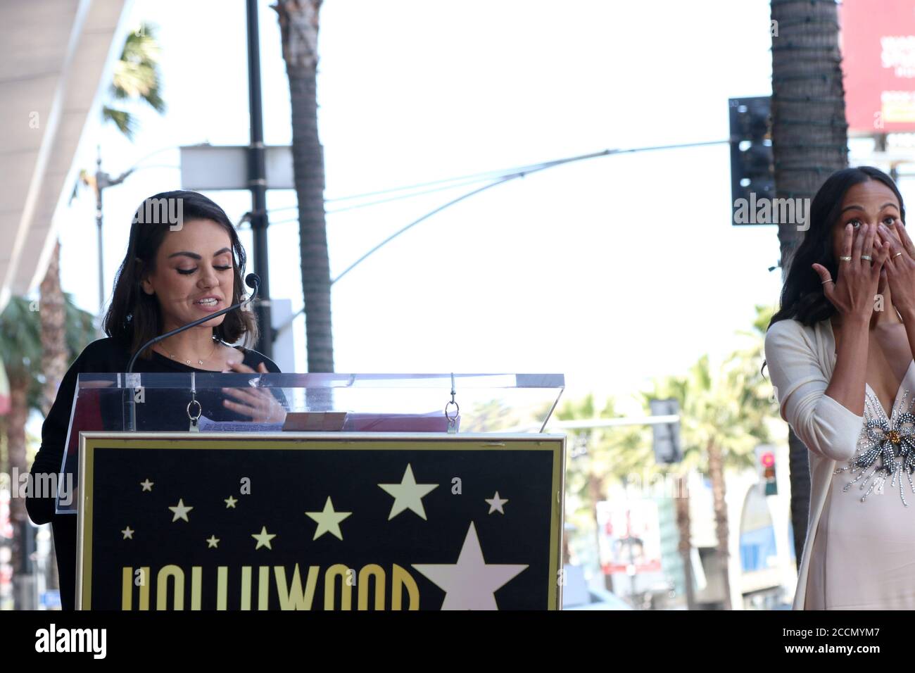 LOS ANGELES - MAY 3:  Mila Kunis, Zoe Saldana at the Zoe Saldana Star Ceremony  on the Hollywood Walk of Fame on May 3, 2018 in Los Angeles, CA Stock Photo