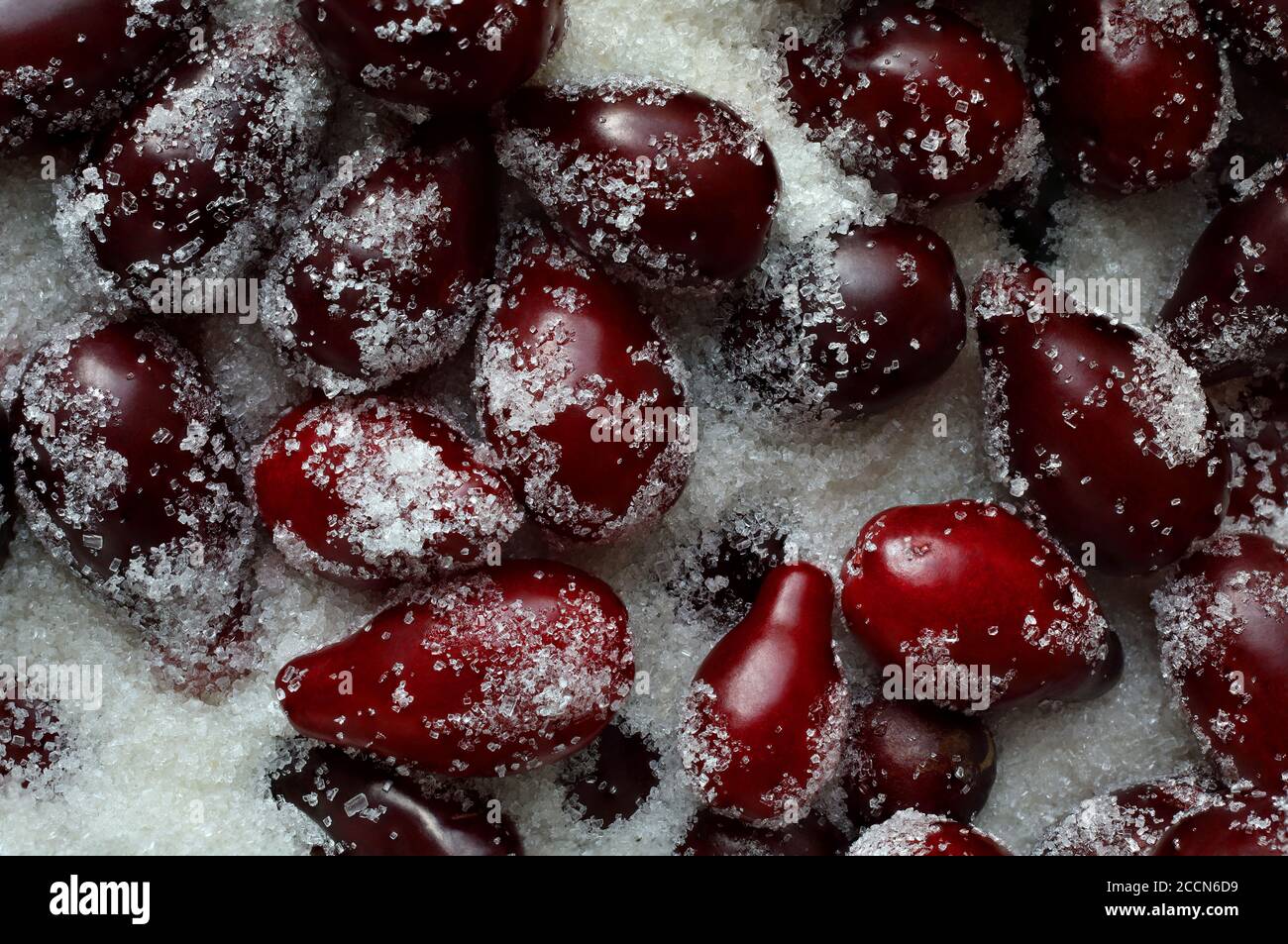 Closeup of ripe picked dogwood berries in sugar,before cooking jam, beautiful delicious background Stock Photo