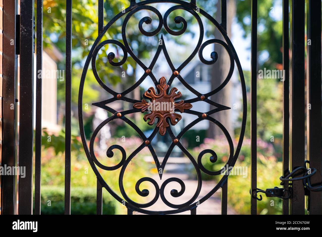 Wrought iron garden gate Stock Photo - Alamy