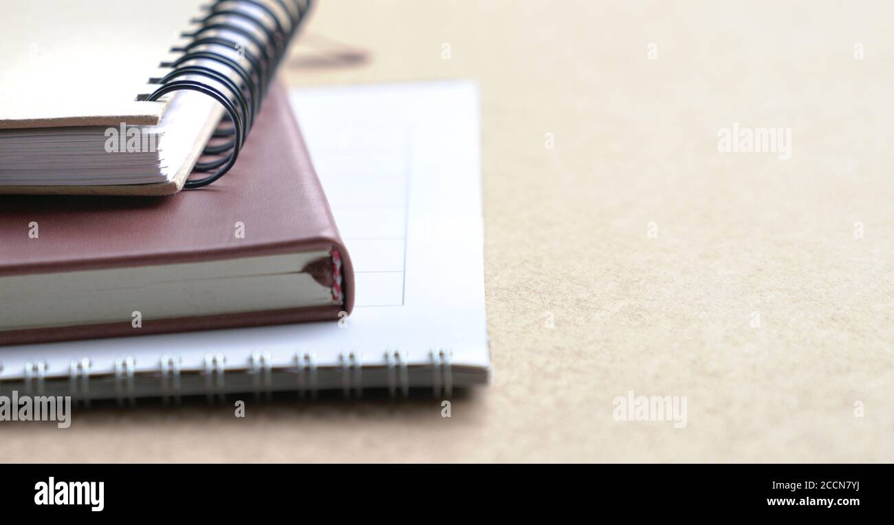 Notebooks and calendar on table. Selective focus. Copy space. Stock Photo