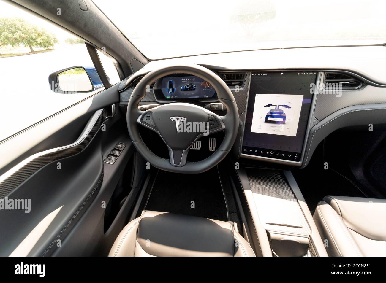 The interior of a full-sized, all-electric, luxury, crossover SUV Tesla Model X. Black and grey. Stock Photo